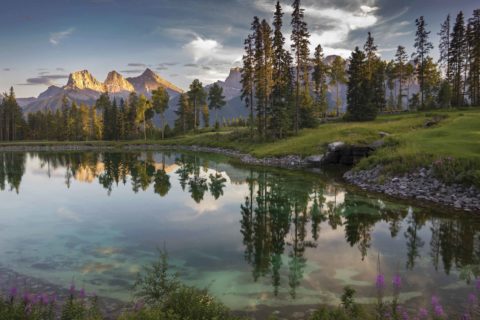 View of the mountains and pond at Silvertip Resort