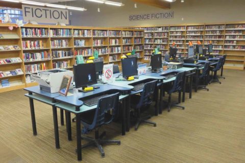 Computer desks and book shelves at the Canmore Public Library
