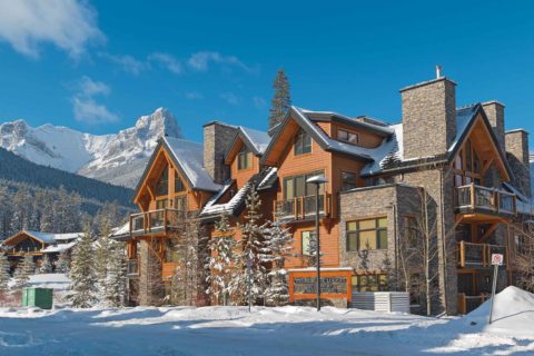 Homes in front of the mountains in Three Sisters Mountain Village